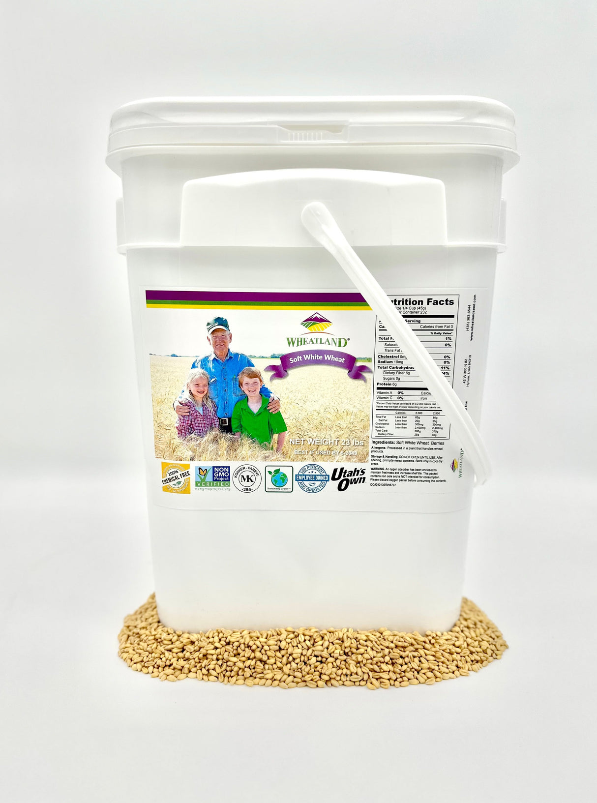 A white plastic bucket labeled with the product name and an image of wheat berries, indicating that it contains 23 lb of soft white wheat berries which are non-GMO, kosher, chemical-free, and have a 25-year shelf-life.